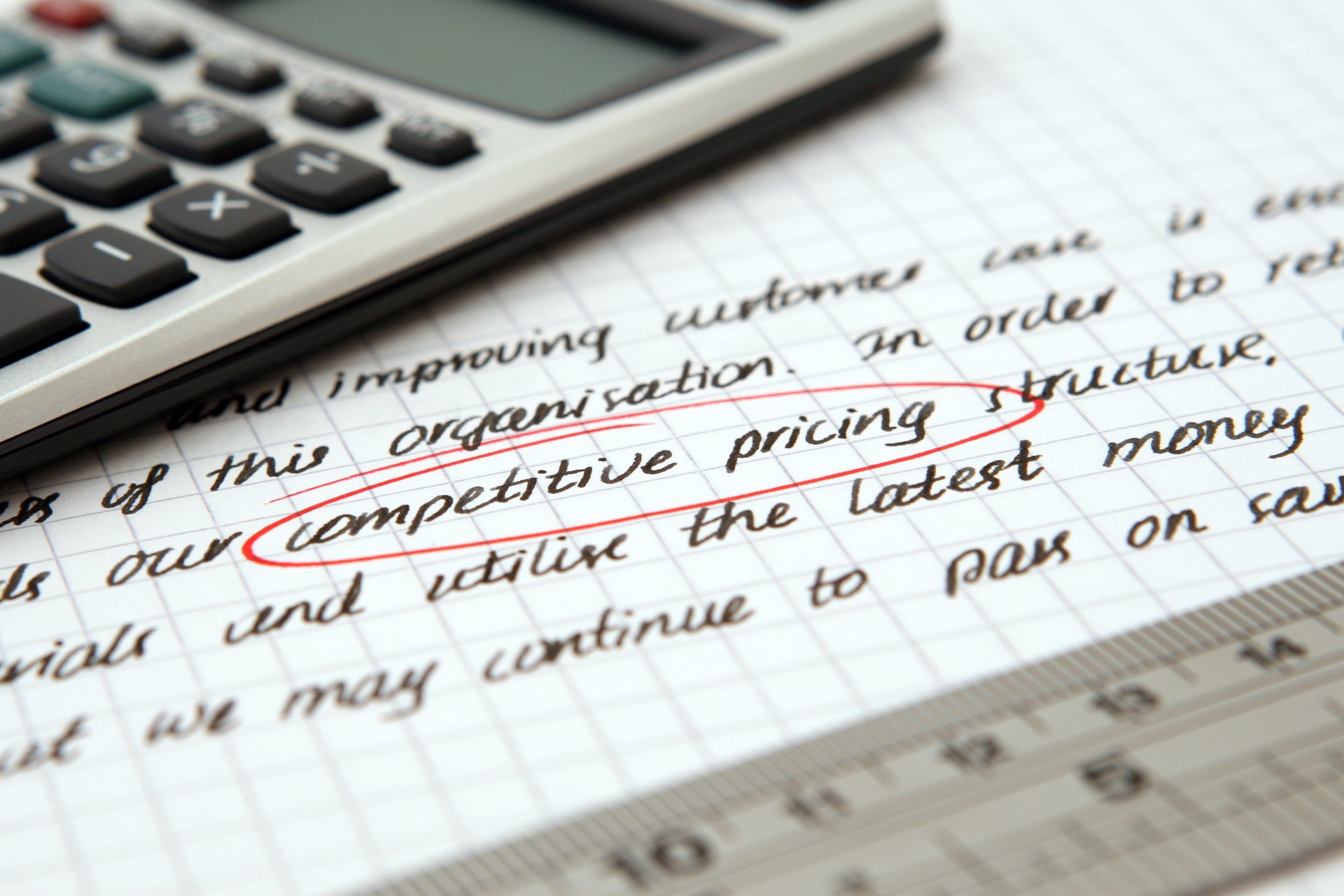 An image of words written on a page with competitive pricing circled in red.