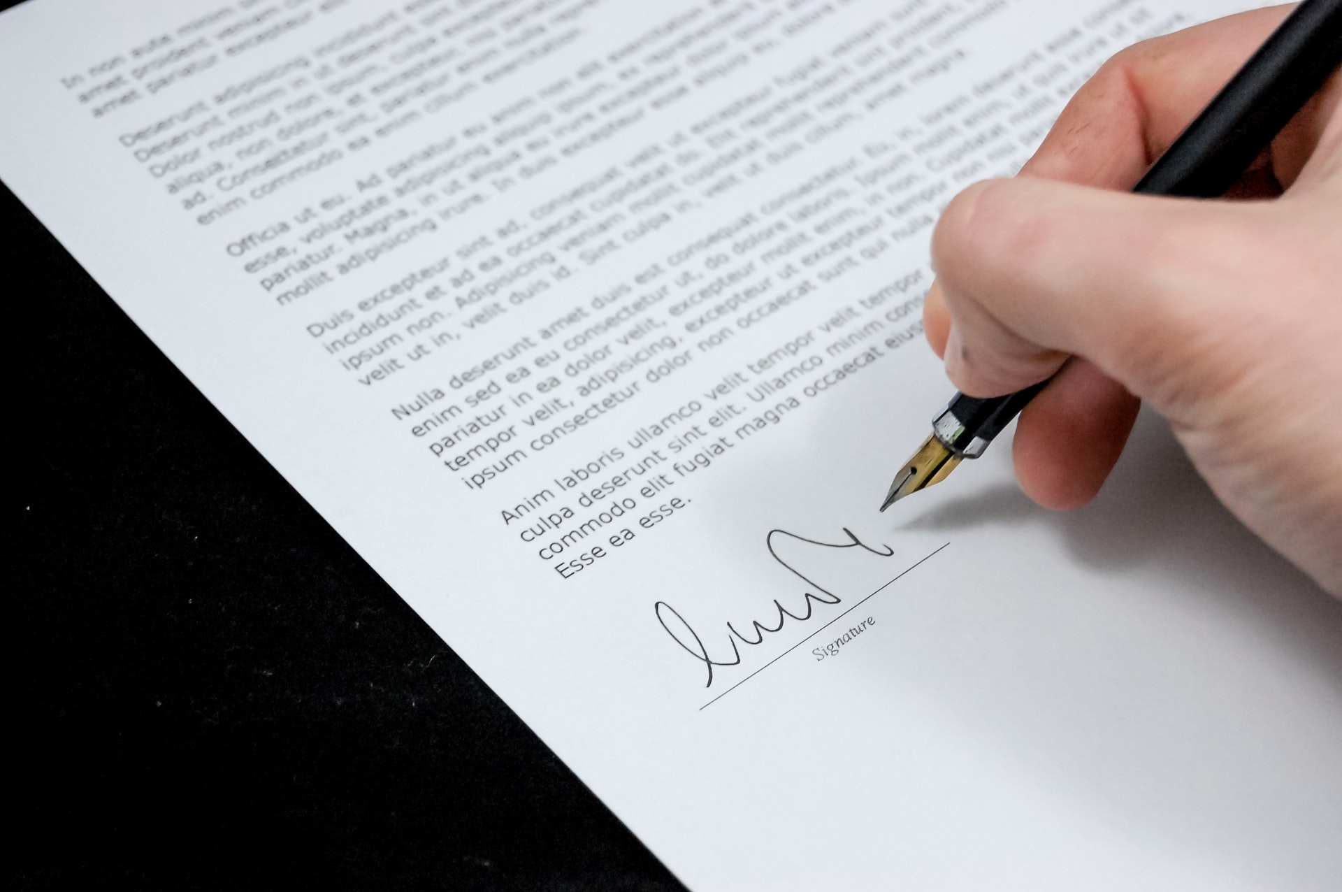 person signing a legal agreement